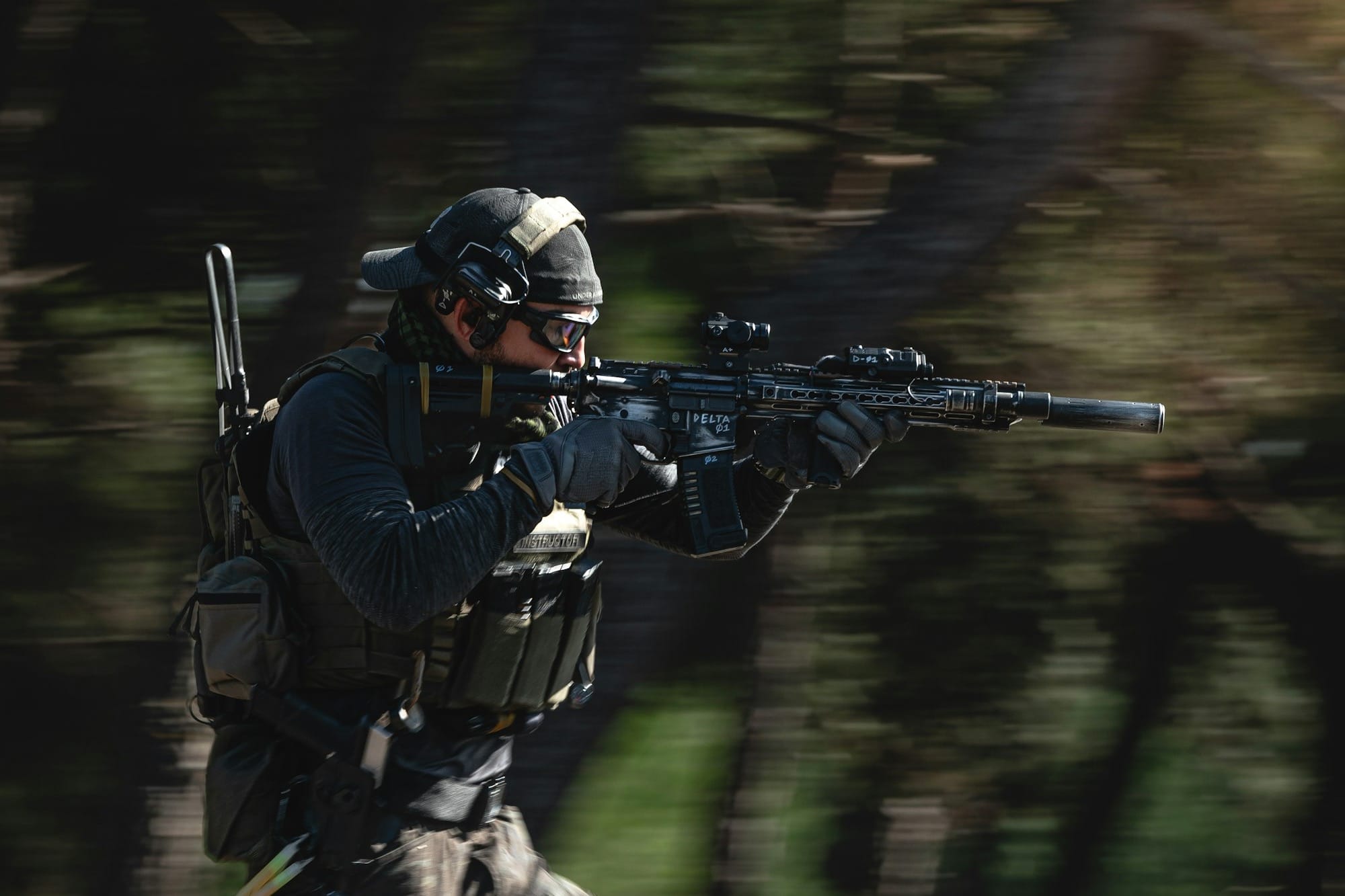 a man running with a rifle in his hand